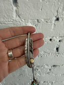 GOROS MULTI FEATHER/ARROWHEAD/CLAW NECKLACE WITH EAGLE/WHEEL CLASP